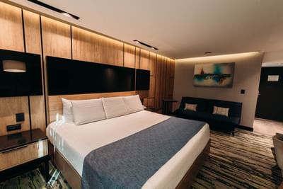 Large bed & sofa in Superior Room at Araiza Mexicali