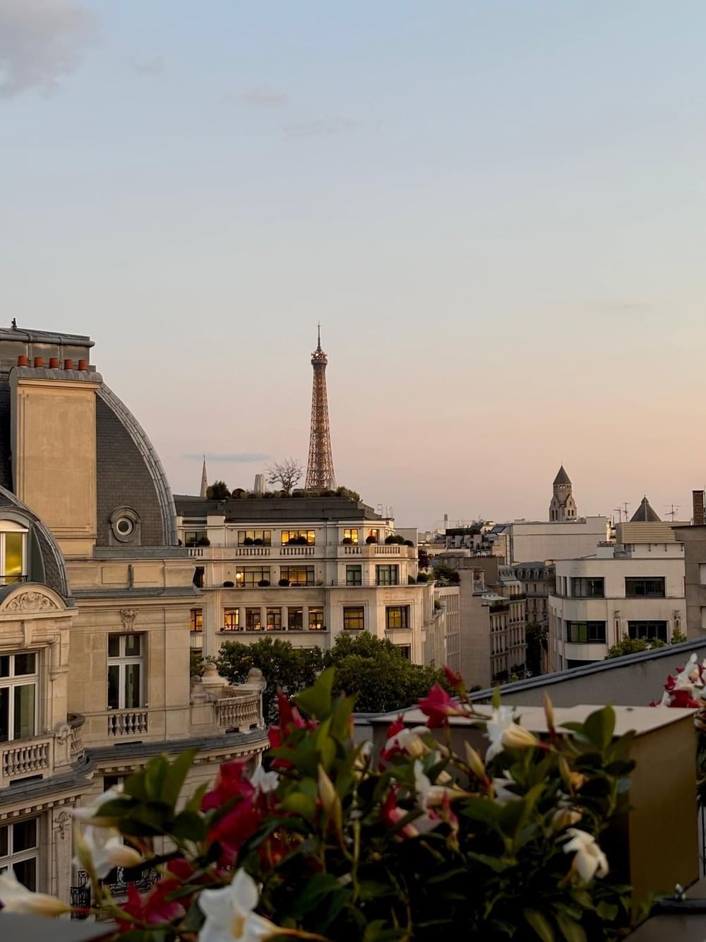 Panoramic city view with the Eiffel Tower above historic rooftops from the Warwick Grand Place Brussels terrace