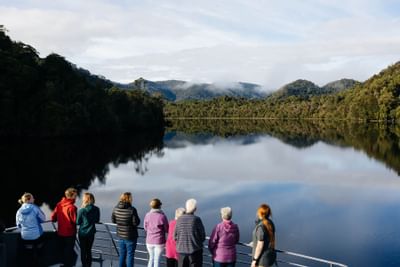 People enjoying the mountain view from Gordon River Cruise