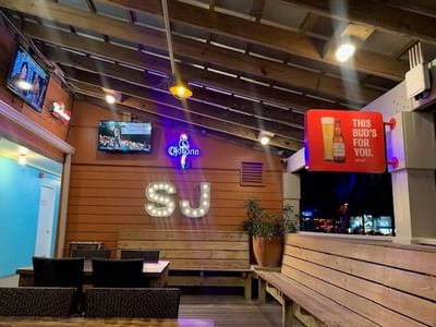Interior of SJ front deck and dining area at Bilmar Beach Resort