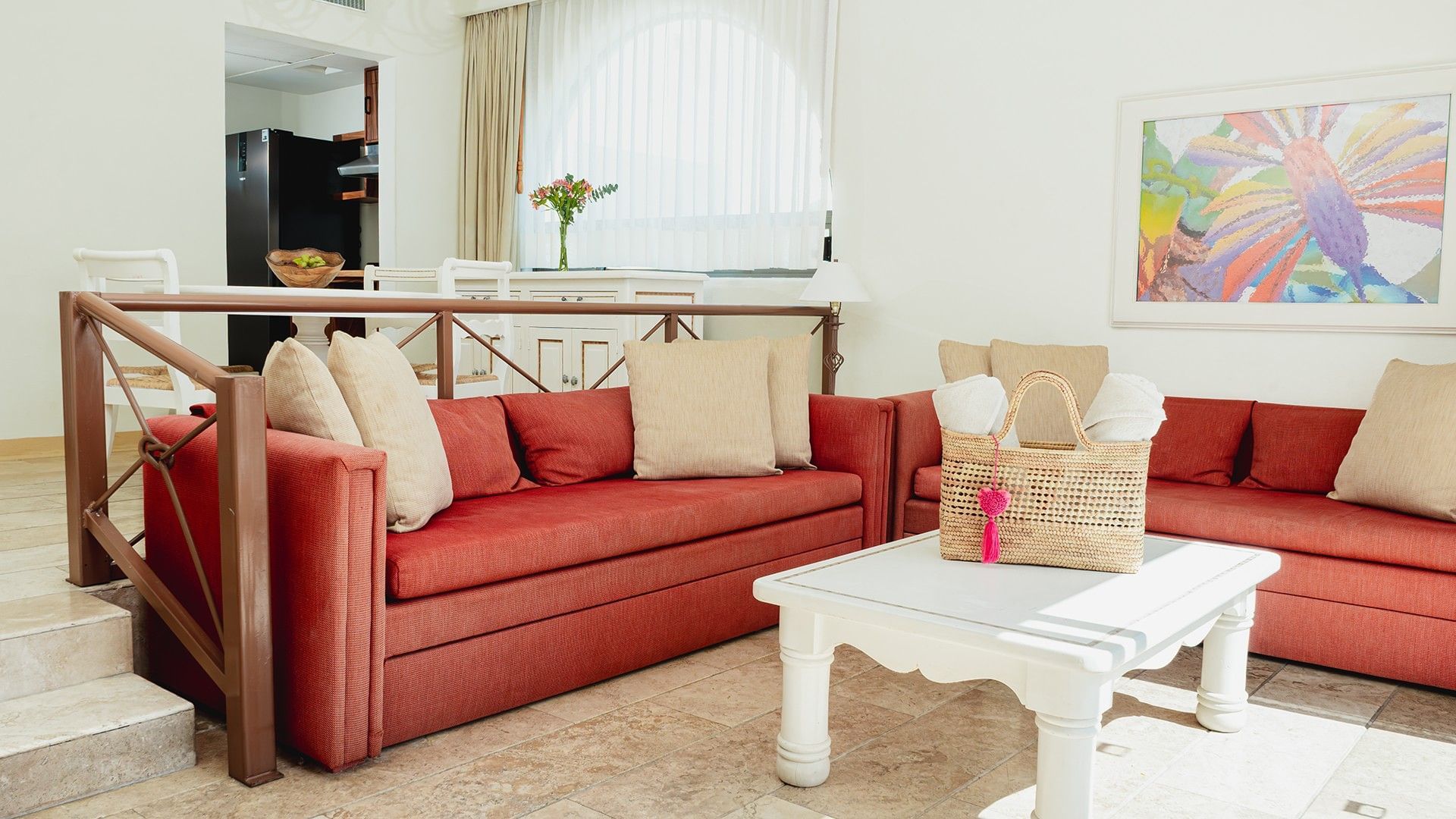 Dining table by cozy lounge area with wooden floors in King Suite Private Pool at Camino Real Zaashila Huatulco