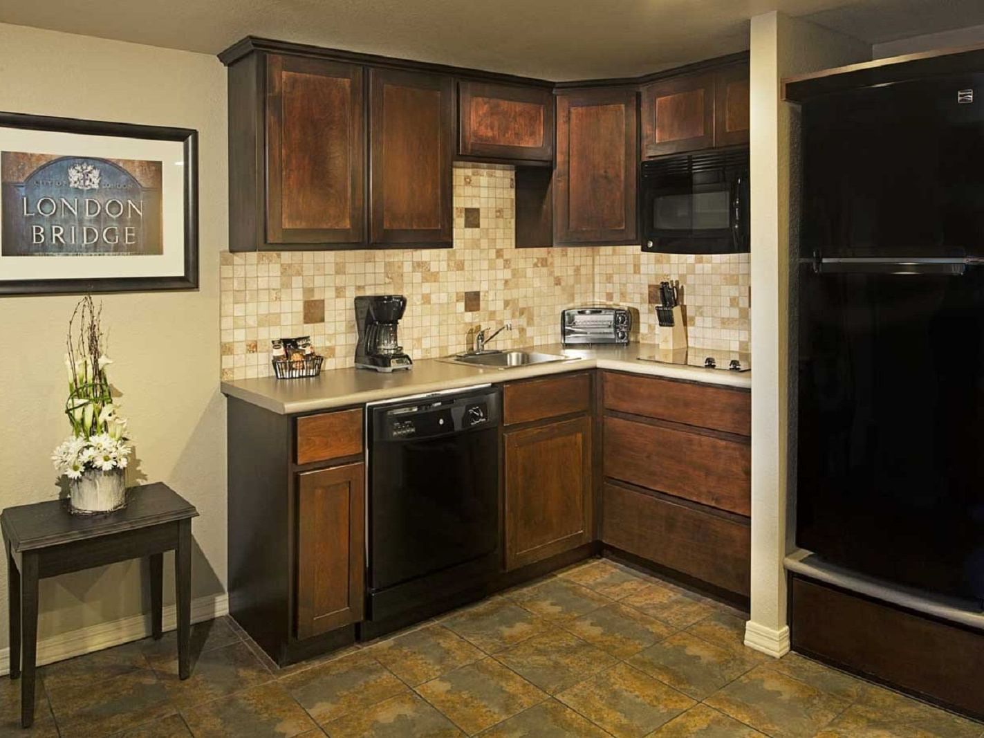 Kitchenette in One Bedroom ADA Suite at London Bridge Resort