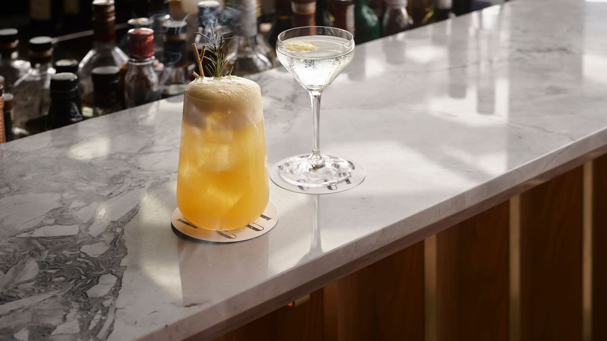 Close-up of cocktail glasses in Woodcut at Crown Towers Sydney