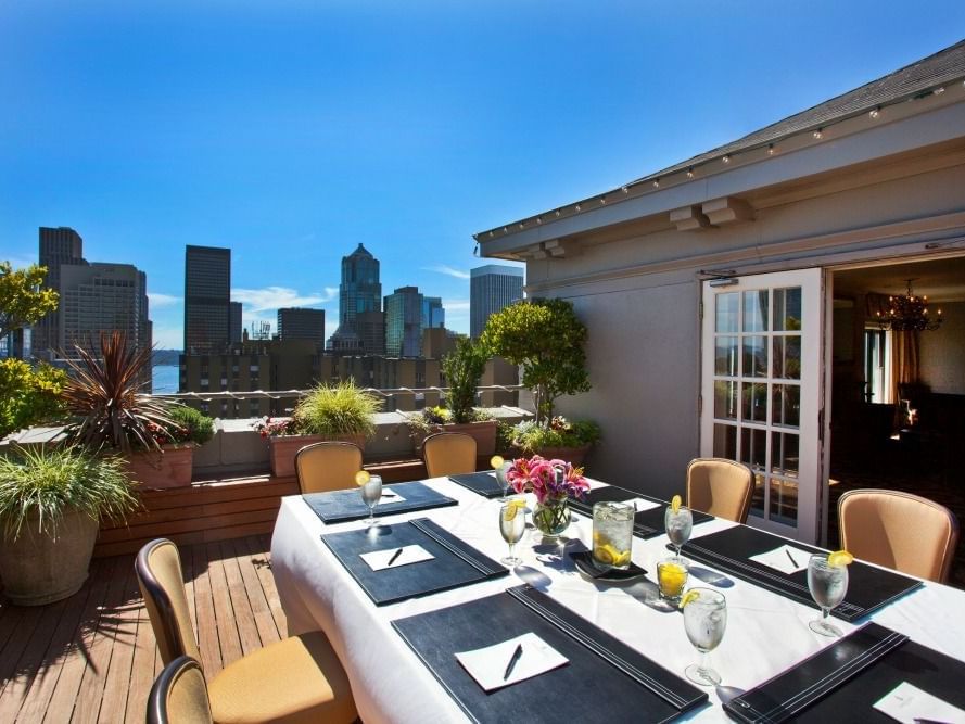 Outdoor dining table setup in the Penthouse at Hotel Sorrento