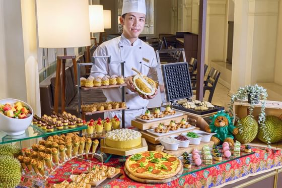 A dessert table with a variety of sweets and pastries displayed at Goodwood Park Hotel