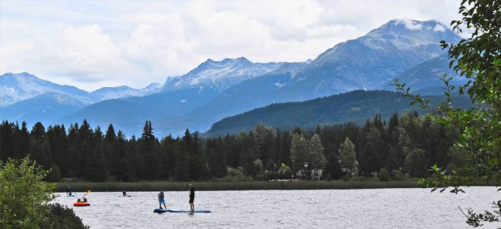 Alta Lake in Whistler with paddleboarders and mountains
