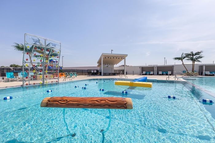 A pool with a water slide and a diving board at Off Shore Resort