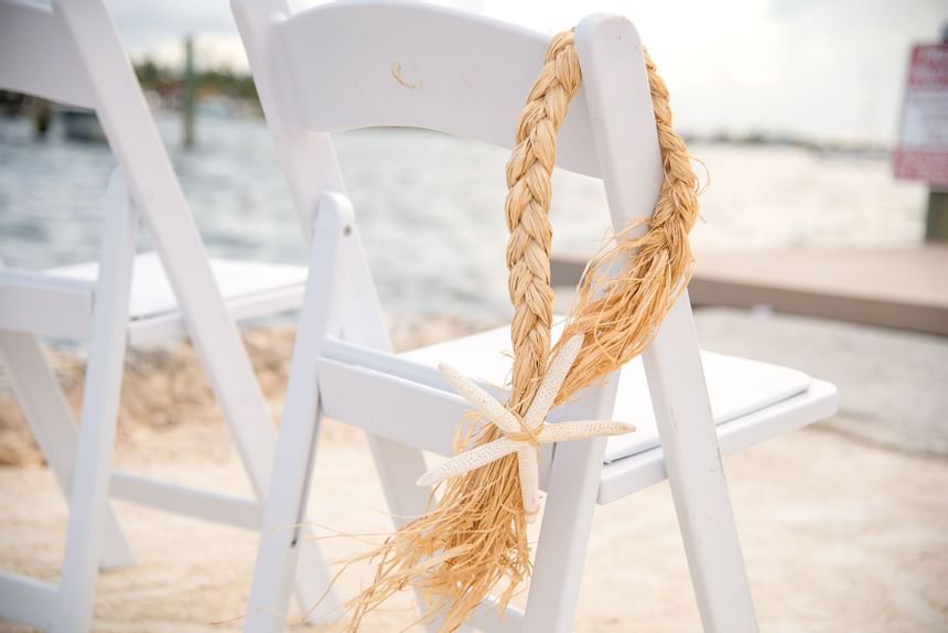 Rope & starfish decor on wedding guest chair at Bayside Inn Key Largo