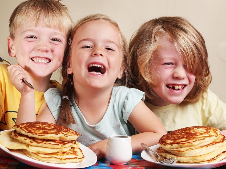 Children having pancakes for breakfast at James Cook Hotel Grand Chancellor