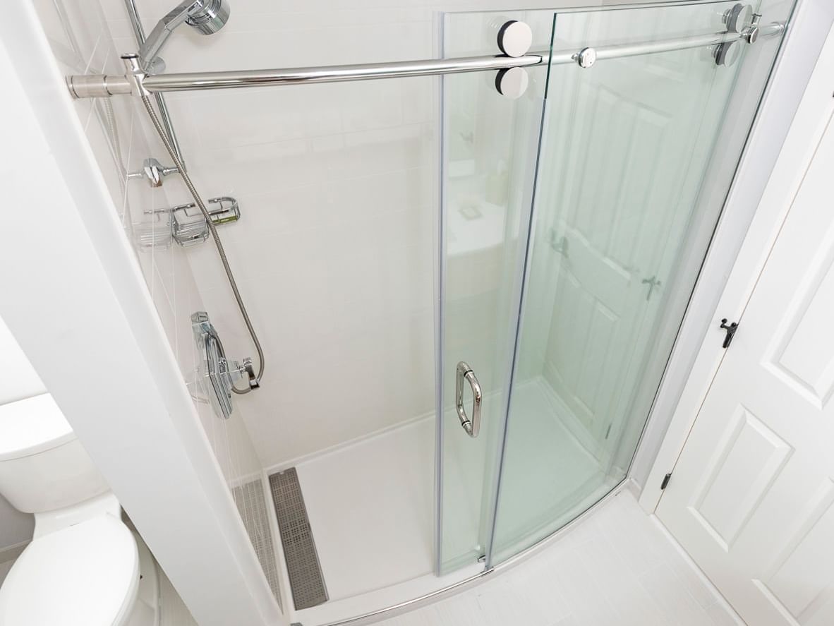 Shower stall with barn door and speakman shower heads