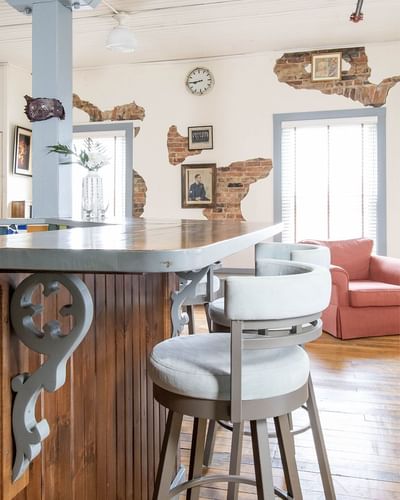 Kitchen area with bar counter & Cozy lounge area in Executive Residences at Retro Suites Hotel