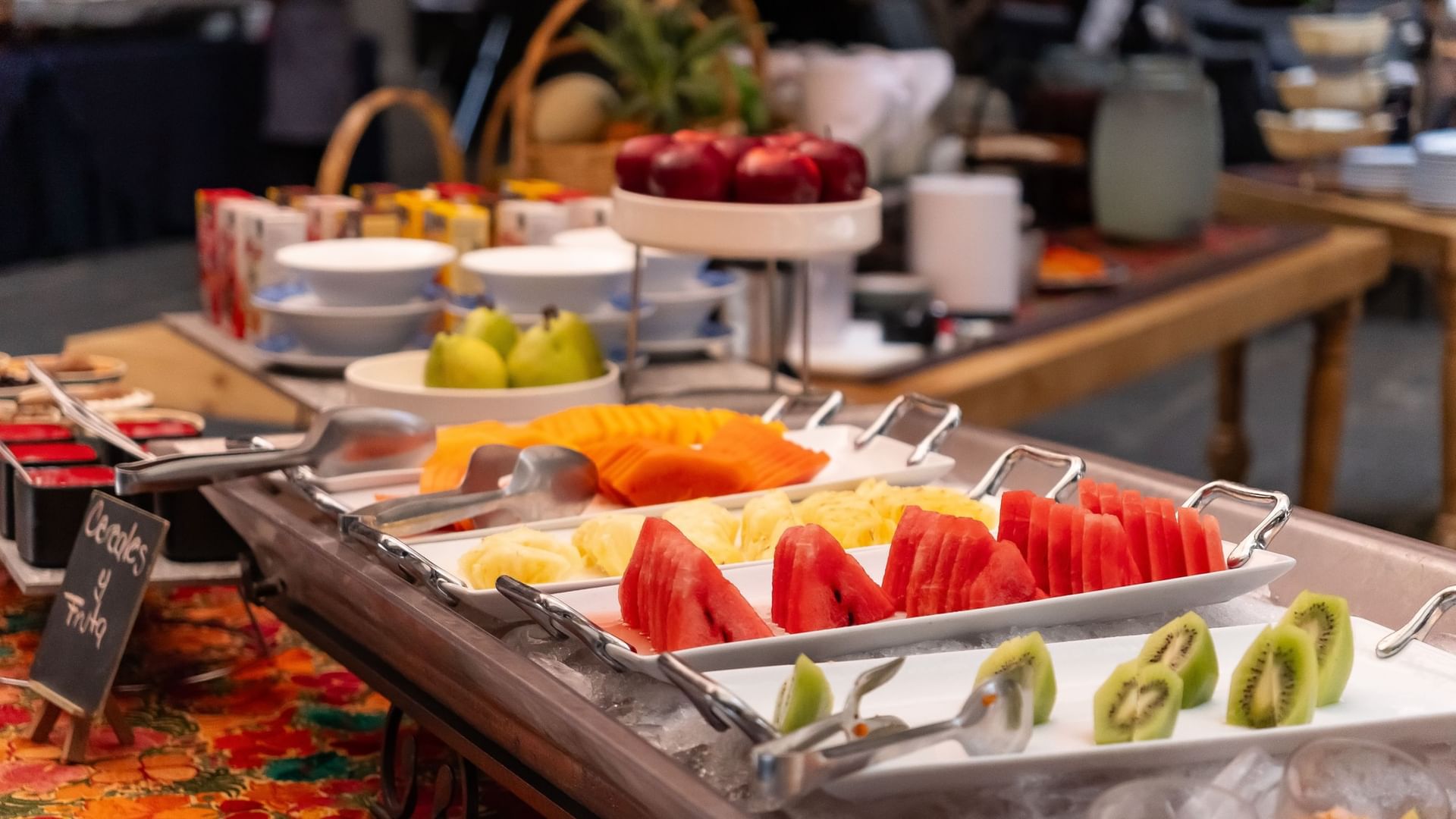 Assorted fruits and desserts on trays at Tierra Mía restaurant in Heroica Puebla de Zaragoza at Quinta Real Puebla.