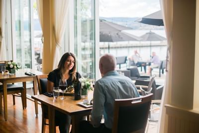 Happy couple enjoying a meal in restaurant.