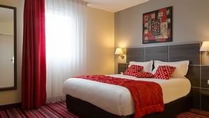 Standard Double room with red striped carpets at Actuel Hotel