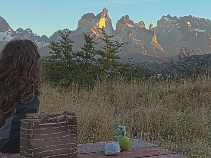 Girl looking over mountains at Hoteles Australis