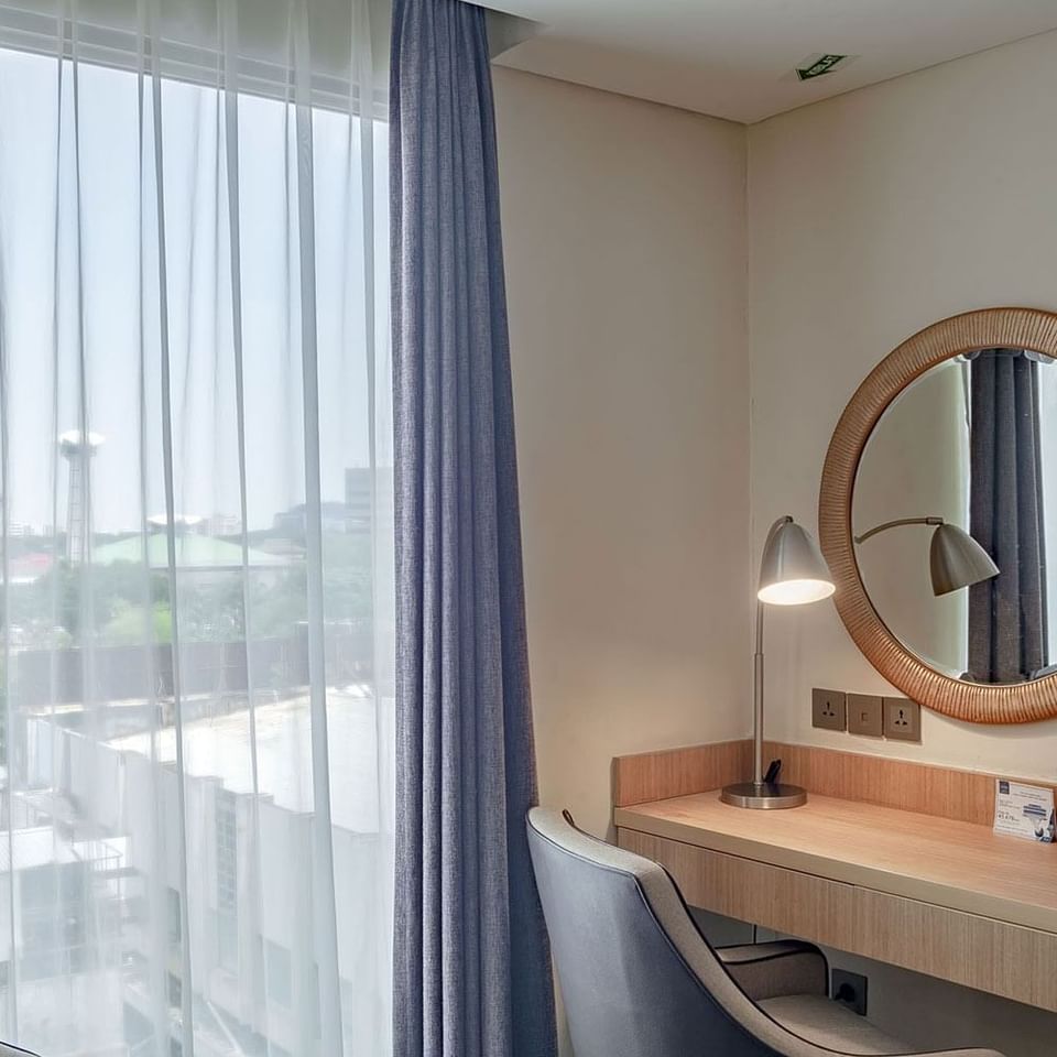 Mirror table and city view in Deluxe King Bed Room at LK Hotel Simpang Lima