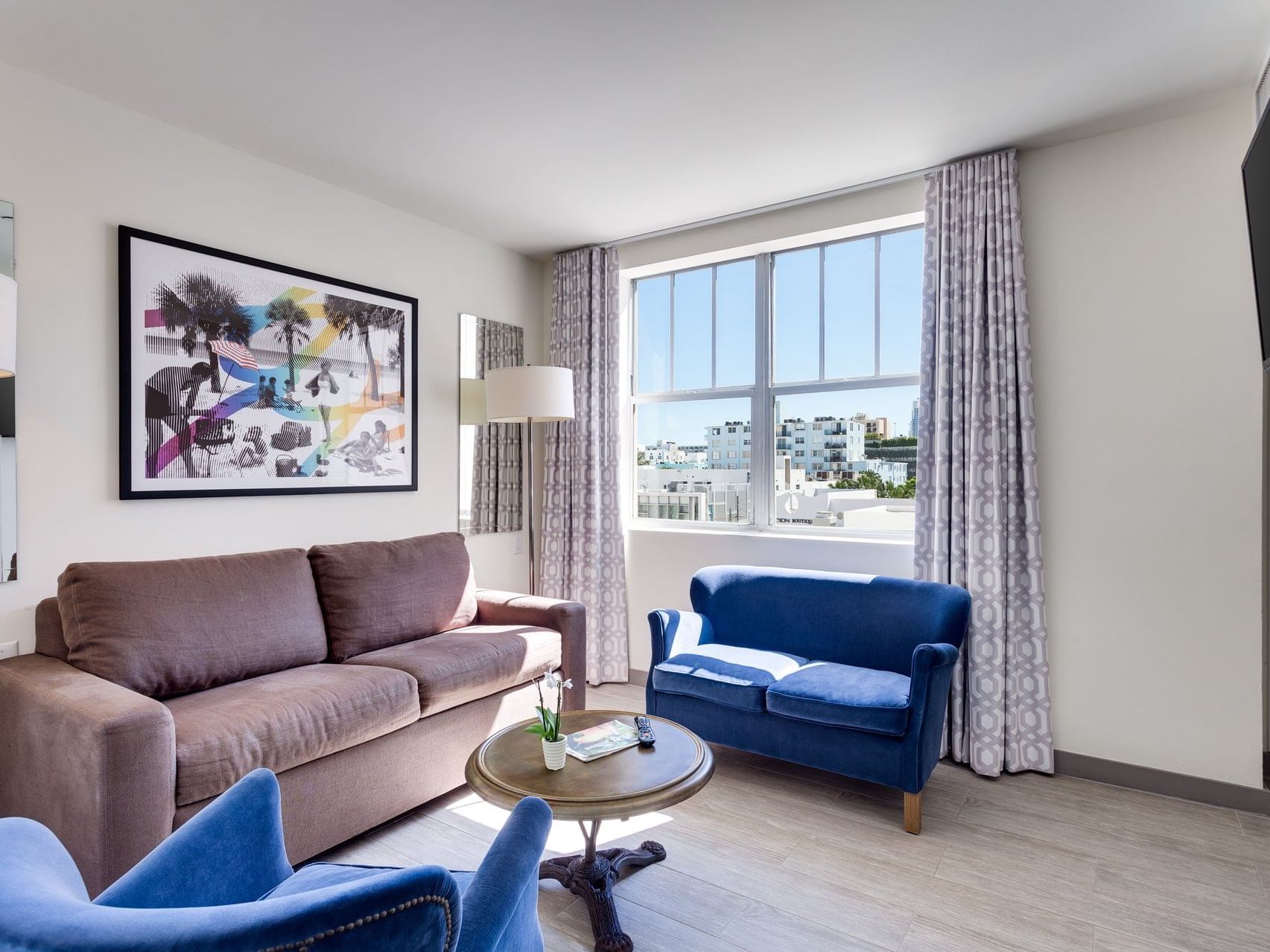 Living room in One Bedroom Pool View Suite at Clinton Hotel