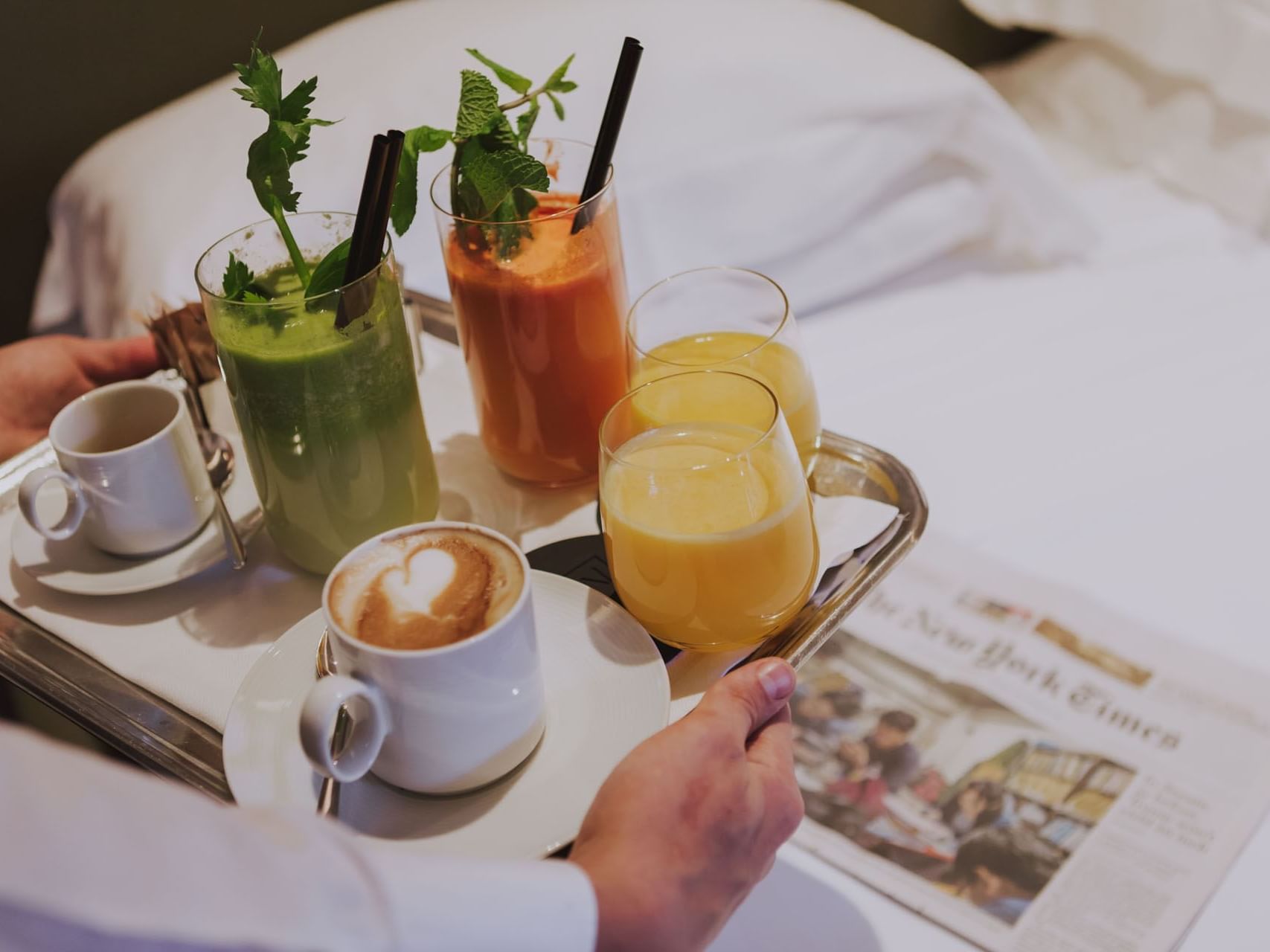 A person serving a variety of beverages in a room at Margutta 19