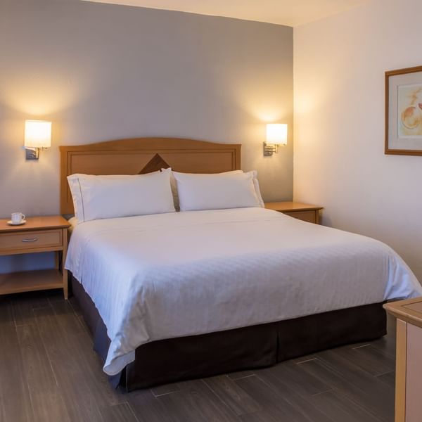 Interior of Junior Suite with king bed at Fiesta Inn