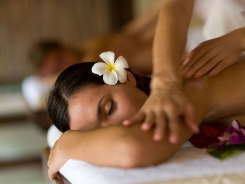 Lady having a body massage in a spa at Grand Fiesta Americana Hotel and Resorts