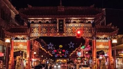 A vibrant night view of the Gate of Harmonious Interest in Victoria's Chinatown near Embassy Inn Victoria