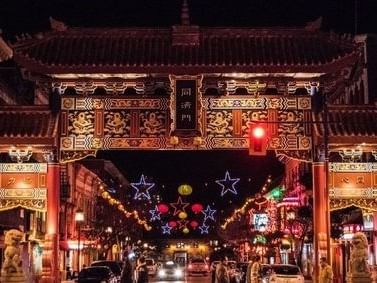 A vibrant night view of the Gate of Harmonious Interest in Victoria's Chinatown near Embassy Inn Victoria