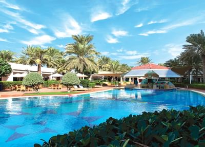 Outdoor swimming pool & Bar at Ajman Hotel