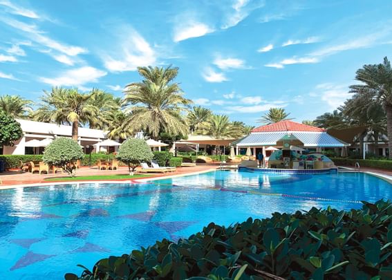 Outdoor swimming pool & Bar at Ajman Hotel