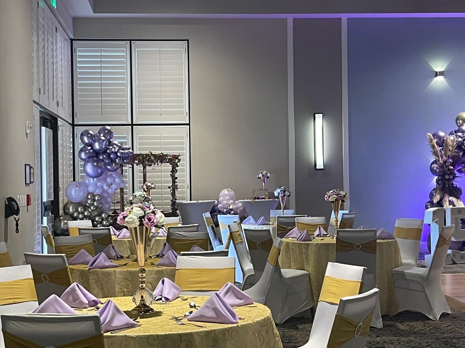 Decorated Serenity Room event space with balloons and tables at Rosen Inn Lake Buena Vista in Orlando.