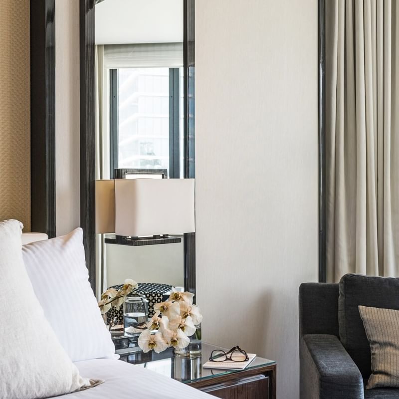 Close-up of bed & night stand in a room at Crown Metropol Perth