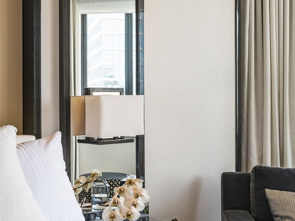 Close-up of bed & night stand in a room at Crown Metropol Perth