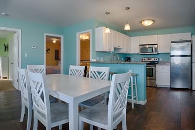 Kitchen area with dining table in 3 Bedroom Apartment - 5 Queen Beds at South Beach Apartments, hotels in Ocean City MD