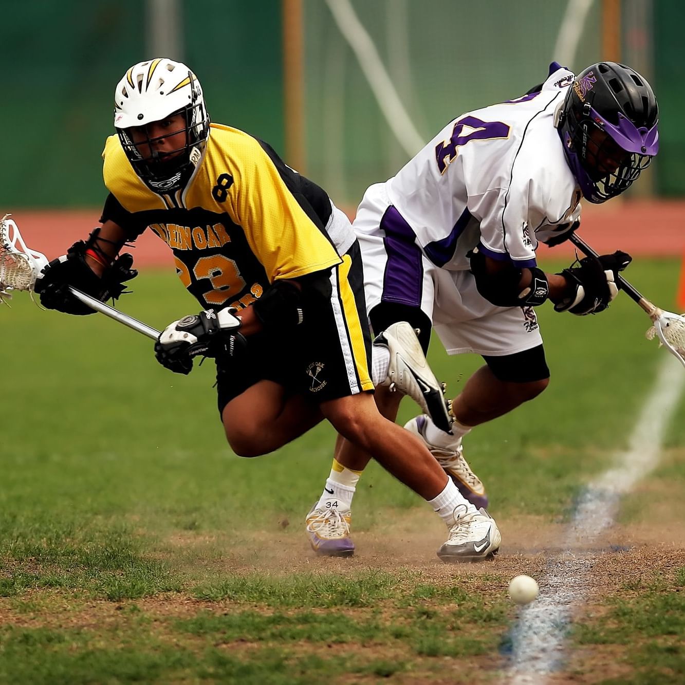 Closeup of 2 Lacrosse players at Lake Placid near Peaks Resort