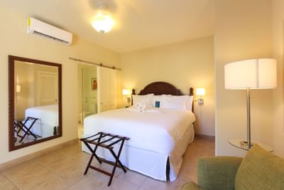 Interior view of bedroom in Island suite at Windsong Resort On The Reef