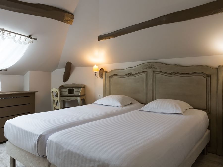 Interior of beds in a room at Hotel Les Poemes de Chartres