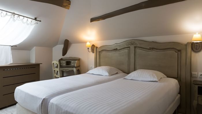 Interior of beds in a room at Hotel Les Poemes de Chartres