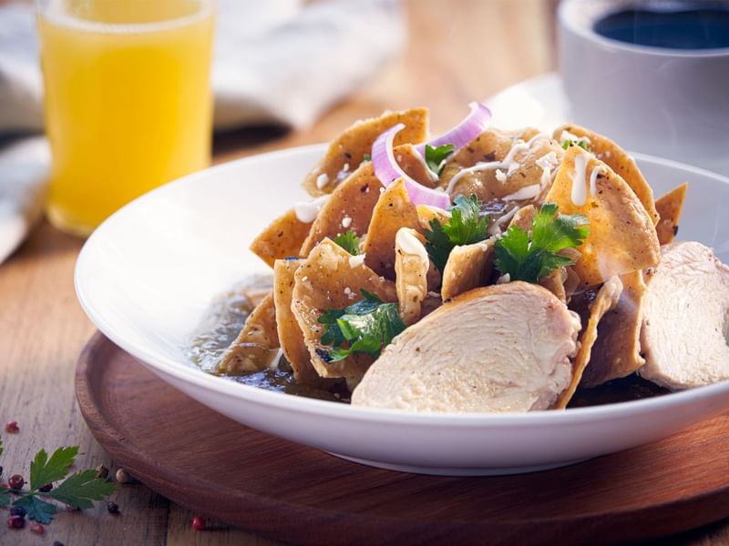 Chilaquiles dish served in Patio de Arbol at Live Aqua Resorts and Residence Club