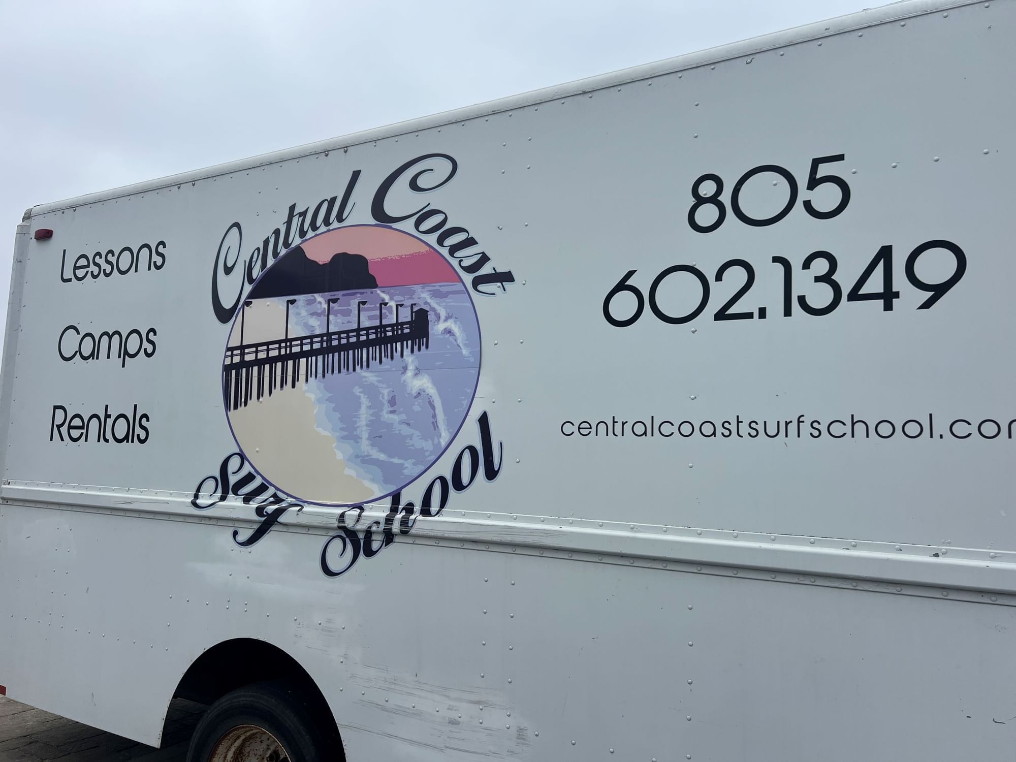 Central Coast Surf School and Kayaks truck with logo on the side