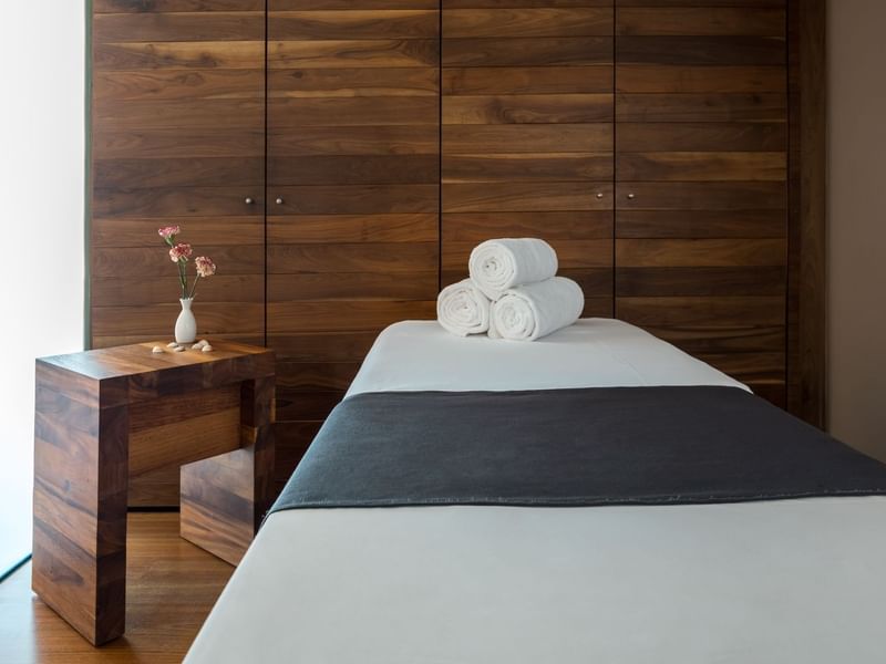 Spa bed with towel rolls at La Colección Resorts