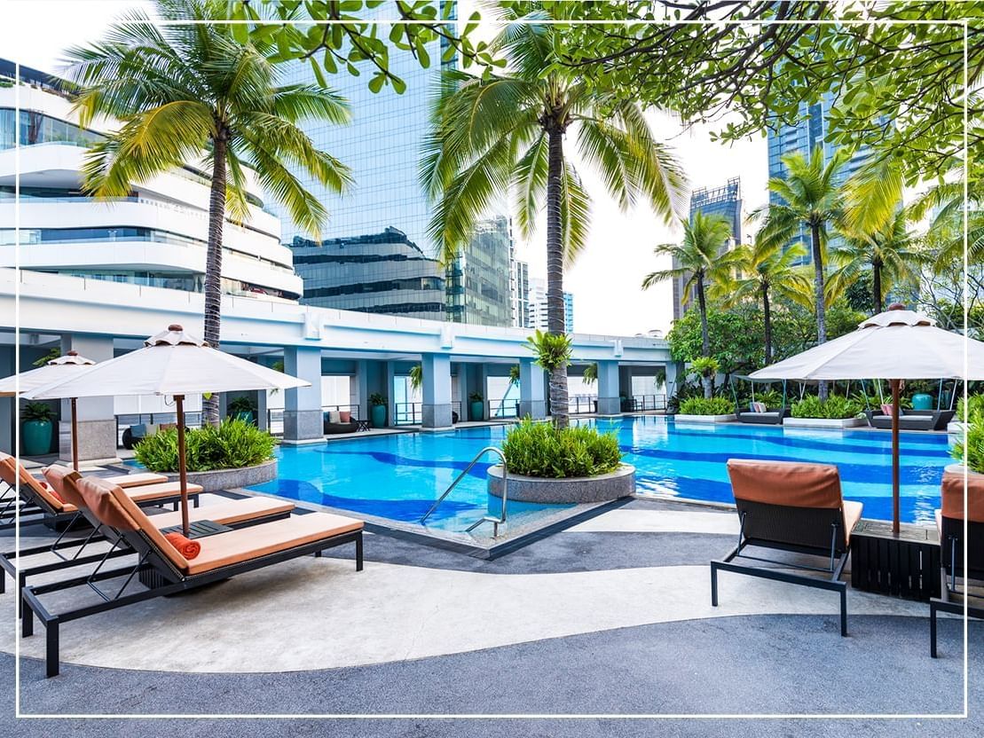 Sunbed area by the pool at Emporium Suite by Chatrium