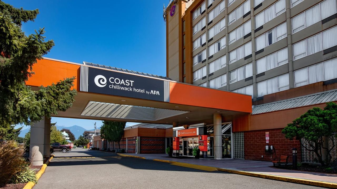 Main entrance and exterior of Coast Chilliwack Hotel by APA on a sunny day.