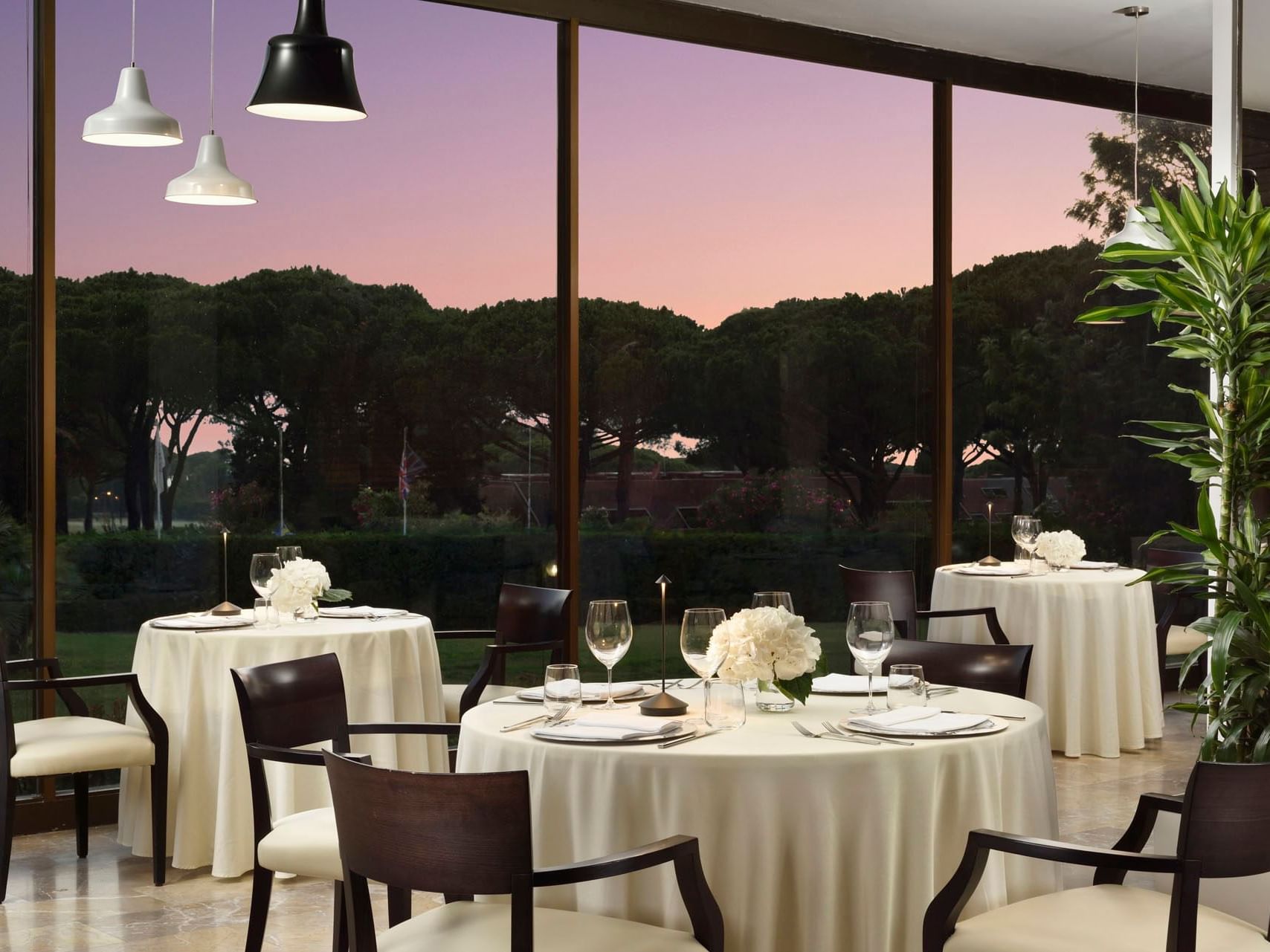 Dining tables in The Golf Restaurant at Golf Hotel Punta Ala