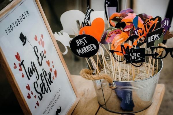 Photobooth entertainment couple booked well in advance, a great way to save money on a wedding