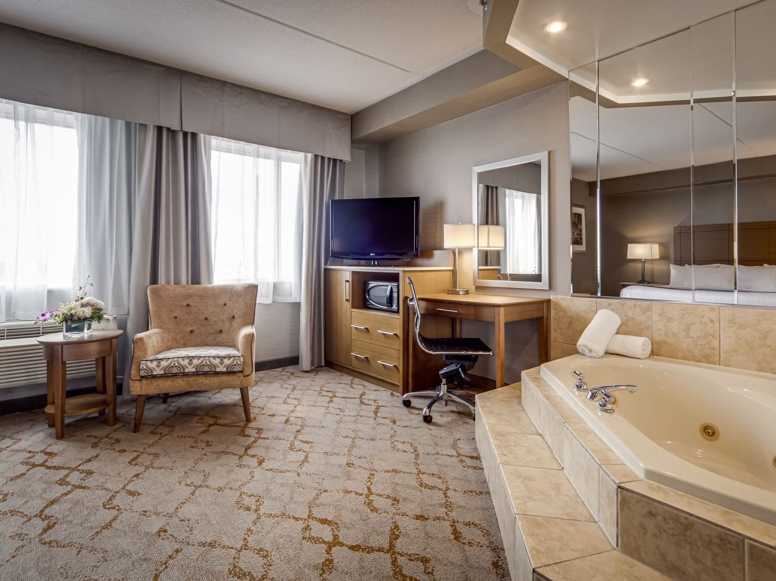 King Jacuzzi Suite lobby with bathtub at Monte Carlo Inn Vaughan Suites