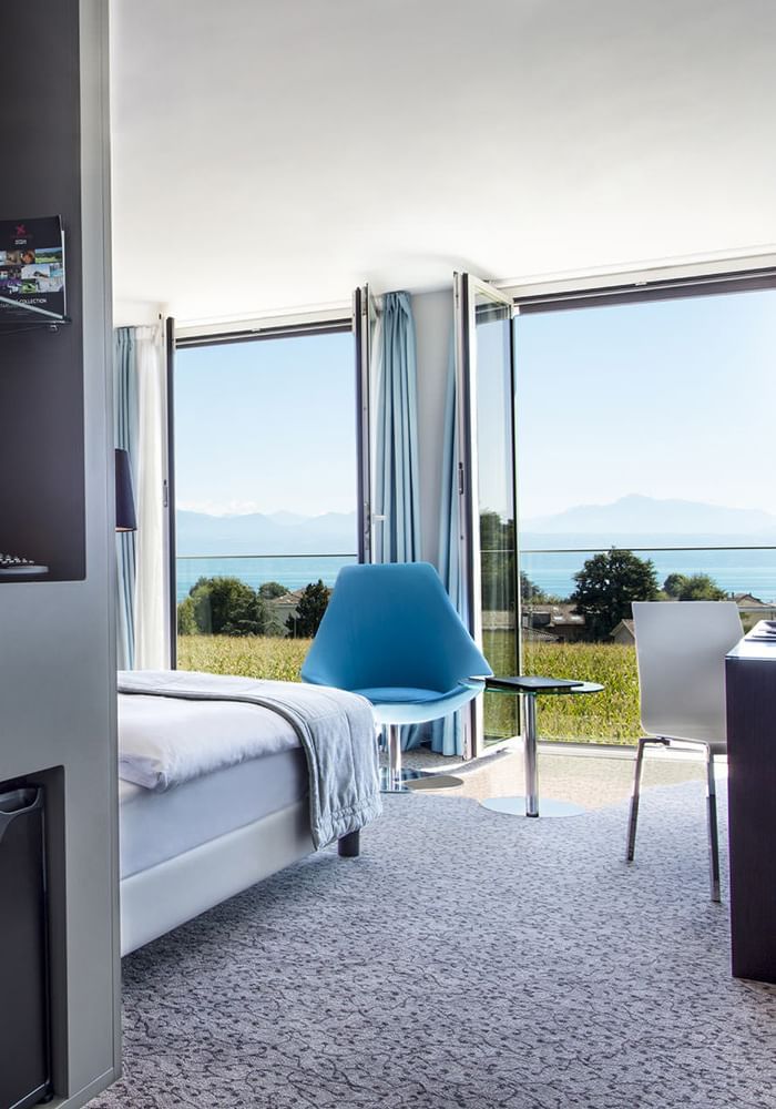 Superior Room with open windows overlooking the garden at Starling Hotel Lausanne accommodation