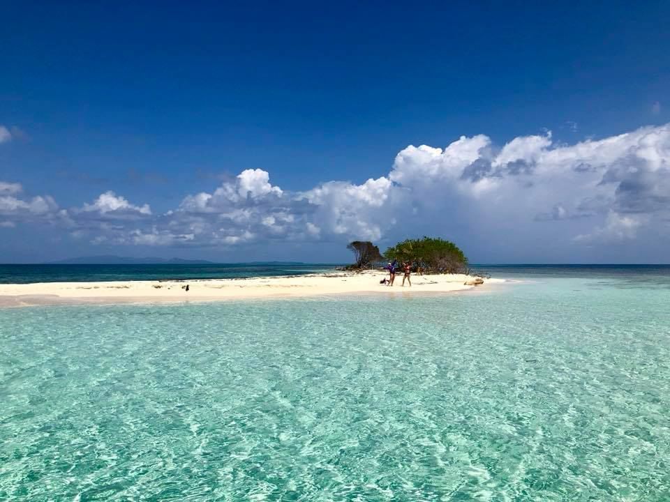 Wide shot of Pigeon Cay during a sunny day at Infinity Bay