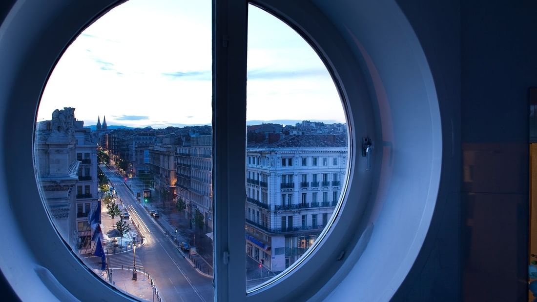 City view of the city through a window at Oceania Hotels Group