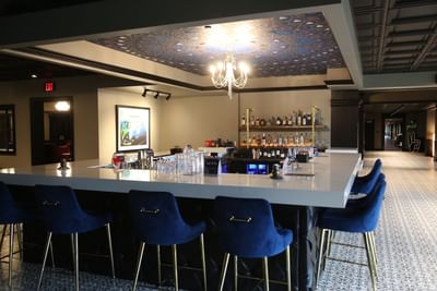 chairs at a bar in a hotel