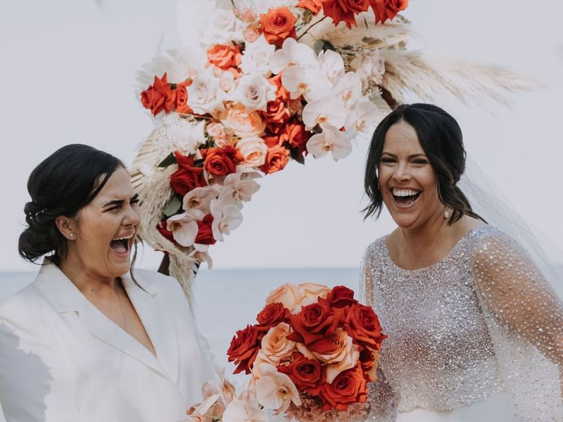 Bride & bridesmaid laughing, Palm Cove Sea Temple Resort & Spa