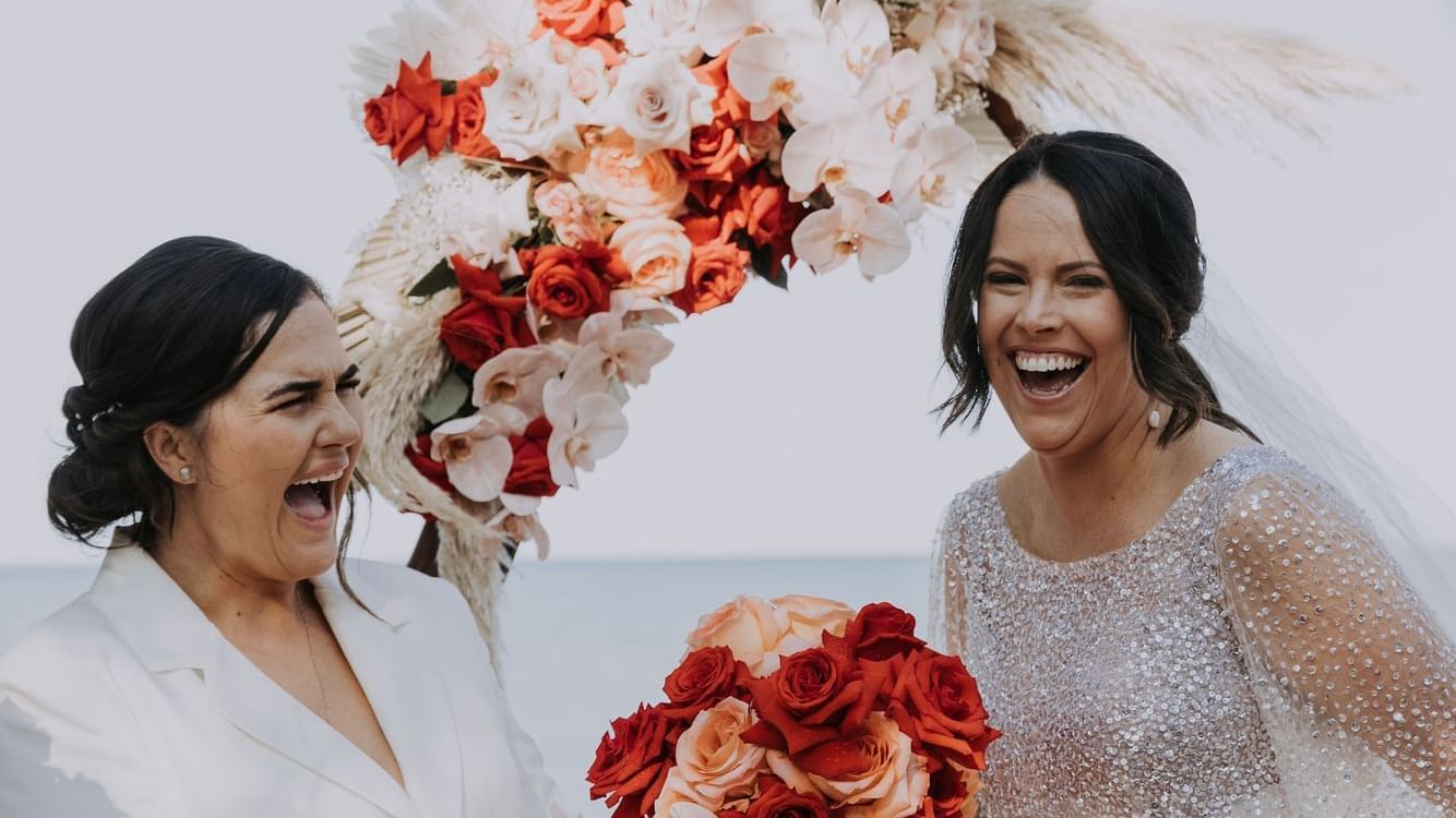 Bride & bridesmaid laughing, Palm Cove Sea Temple Resort & Spa